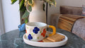 Handcrafted Floral Ceramic Cup & Saucer Set with Biscuit Holder